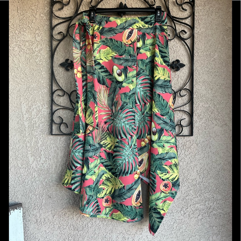 Nylon apparel papaya & avocado tropical print asymmetrical skirt.